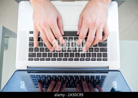 Work on a laptop - as always, the programmer pretends to work Stock Photo