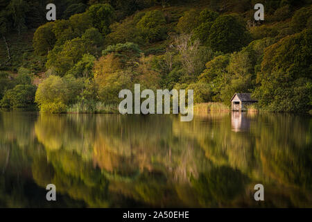 The Old Boathouse at sunset at Rydal Water on the River Rothay, Lake District, UK Stock Photo