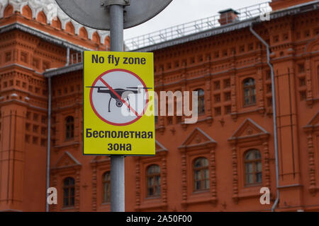 Sign No Fly Zone, the silhouette of drone crossed out by prohibition strip. The ban on flights in the capital of Russia, Moscow. Sign prohibiting flyi Stock Photo