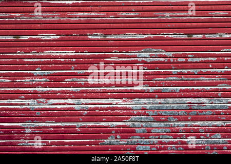 Rusty, peeling building shutters background. Stock Photo