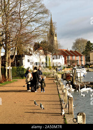 Waterside scene at Windsor Bridge with the Church of St John The Baptist, High Street, in the background Stock Photo