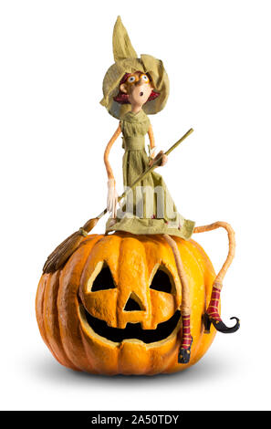 Cute Witch sit on carved Pumpkin. Funny halloween Stock Photo