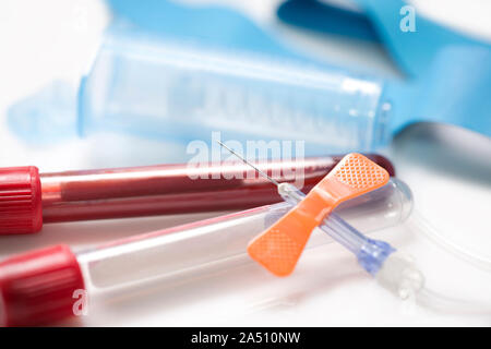 Close up of blood collection catheter with blood tubes and equipment. Stock Photo