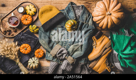 Autumn trendy women outfit layout over wooden background Stock Photo