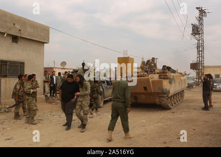 October 16, 2019: Tal Abyad, Syria.16 October 2019. Members of the Syrian National Army take control of towns on the west of the Syrian city of Tal Abyad during the Turkish military offensive against the Syrian Democratic Forces (SDF) and the People Protection Unit (YPG) in northern Syria, on the east of the Euphrates. The ongoing Operation Peace Spring was launched by Turkey on 9 th October with the stated purpose to push the YPG from the Turkish border and to create a safe zone in northern Syria for the return of Syrian refugees, and has been joined by the Syrian National Army opposition for Stock Photo