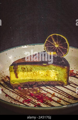 Pistachio & Yuzu Feuilletine Cake A springtime delight; light and zesty cake that refreshes the palate Stock Photo
