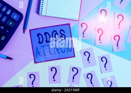 Handwriting text Ddos Attack. Conceptual photo perpetrator seeks to make network resource unavailable Mathematics stuff and writing equipment above pa Stock Photo