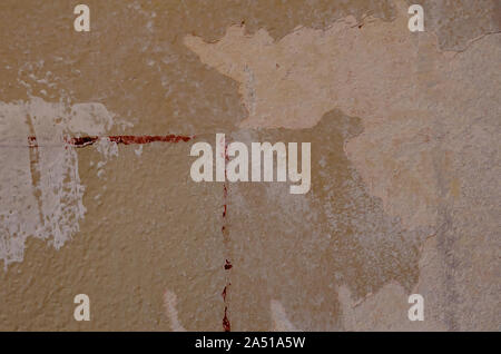 Textured background of a wall losing its paint Stock Photo