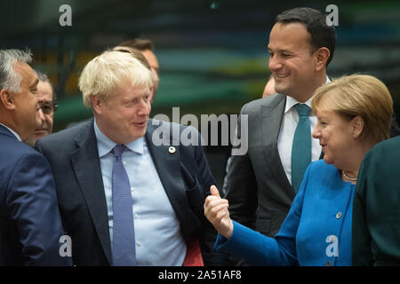 Prime Minister Boris Johnson (centre left) with Taoiseach Leo Varadkar (2nd right) and Chancellor of Germany Angela Merkel at a round table for the European Council summit at EU headquarters in Brussels. Stock Photo