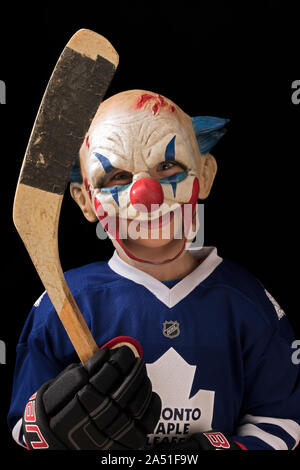 child in halloween costume as a hockey player Stock Photo