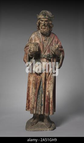 Magus from an Adoration Group, c. 1460-1475. This sculpture represents one of the three Magi or kings who witnessed the birth of Jesus. The Magi are identified as Caspar, Melchior, and Balthazar and are typically shown in art bearing their gifts of gold, frankincense, and myrrh. Joseph is often present in these scenes as are shepherds.The single figure shown here was originally part of a sculptural group with many figures. He is shown holding an ornate receptacle with lid. Other figures from the group are not known to have survived, and which Magus the sculpture was intended to represent canno Stock Photo
