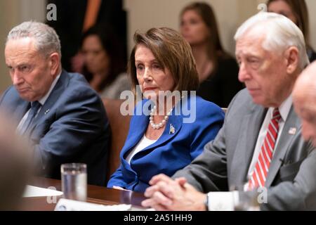 Washington, United States of America. 16 October, 2019. U.S Speaker of the House Nancy Pelosi, center, with Senate Minority Leader Chuck Schumer, left, and House Majority Leader Steny Hoyer, right, during a meeting on Kurdish crisis in the Cabinet Room of the White House October 16, 2019 in Washington, DC. The meeting called by the president to discuss the crisis along the Syrian - Turkey border devolved into a confrontation before the Speaker walked out.   Credit: Shealah Craighead/White House Photo/Alamy Live News Stock Photo