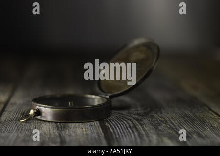 Old compass on the table Stock Photo