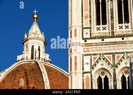 Giotto's bell tower detail and Duomo lantern of Santa Maria Del Fiore, Florence, Italy Stock Photo