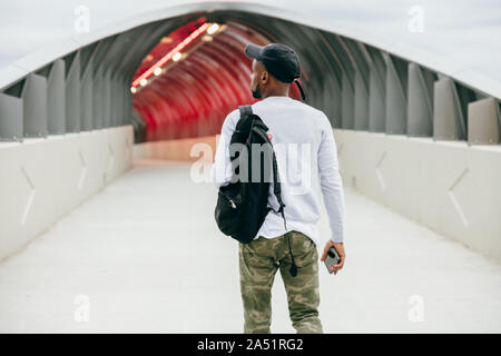 Man walking to airport terminal for vacation Stock Photo