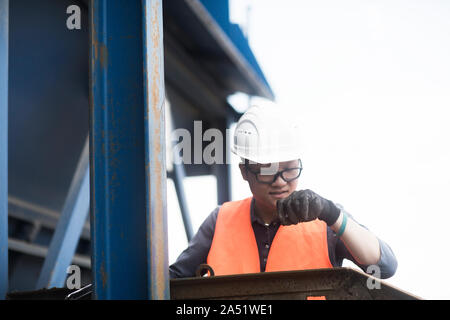 young worker in a concrete factory Stock Photo