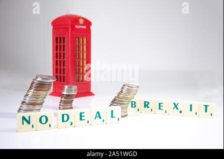 UK No Deal Brexit. The words spelled out on a white background with coins and an English telephone booth. Brexit concept Stock Photo