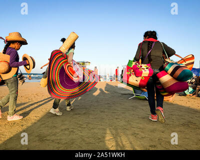 Women selling their craft souvenirs over the Mexican beach. Stock Photo
