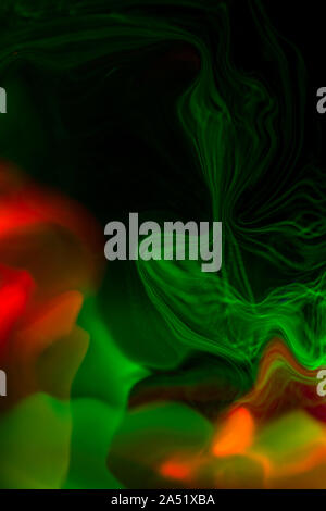 Stylish light painting with green and orange colors, on background Stock Photo