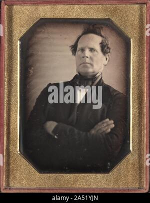 Portrait of Man Leaning Away from Camera, late 1840s. Although portrait sittings were directed by the photographer, sitters had some input in shaping their identities by choosing their pose, clothing, possessions, and sometimes backdrop. People came to the studio dressed in their finest outfits, and they often brought objects to represent their interests or occupation, such as the tuning fork held by the music teacher. Hand painting could draw attention to luxury items, as in  Young Woman with Pantalettes,  where her jewelry is dabbed with gold paint and the lacy cuffs of her pantalettes are e Stock Photo