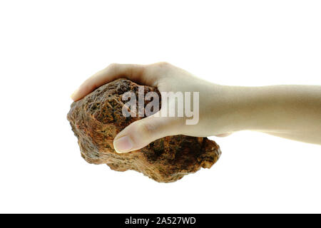 Close up hand is holding stone isolated at white background Stock Photo