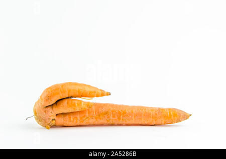 ugly food. carrot on a white background. copy space Stock Photo