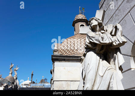 Sculpture of a Christ carrying a big cross inside the Recoleta monumental cemetery, Buenos Aires, Argentina. Stock Photo