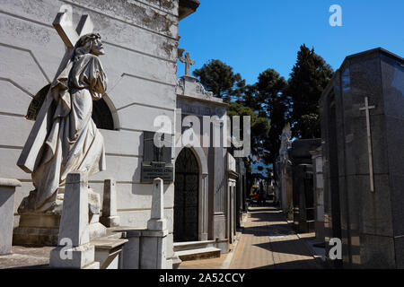 Sculpture of a Christ carrying a big cross inside the Recoleta monumental cemetery, Buenos Aires, Argentina. Stock Photo