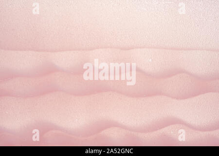 Delicate pink texture and strokes of a cosmetic face mask or cream on a white background Stock Photo