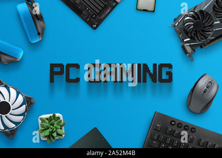 PC gaming text surrounded with gaming computer components. Stock Photo
