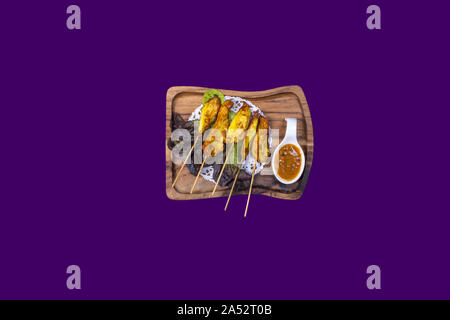 Asian Thai food on white plates with purple background with copy space Stock Photo