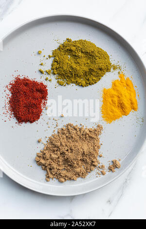 directly above shot of various spices on plate Stock Photo