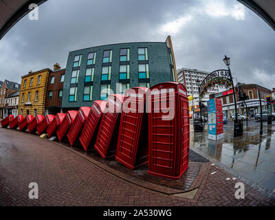 London, England, Un ited Kingdom - August 1, 2019: Red telephone booth symbols of England in the main market square of Kingston upon Thames city Stock Photo