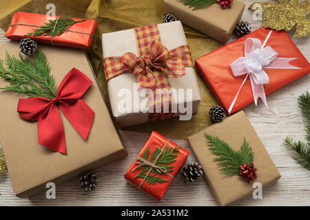 gift boxes with bows and ribbons on a wooden background Stock Photo