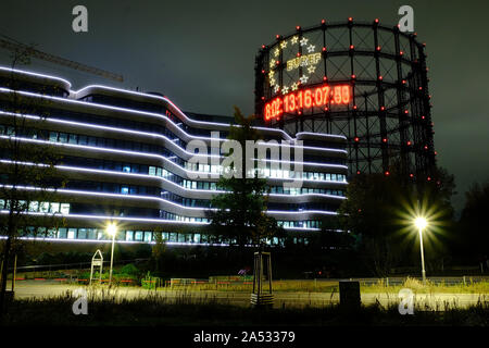 October 17, 2019, Berlin, Berlin, Germany: A 40 metre carbon clock installation by installation by Fridays for Future can be seen during nighttime at the historic Gasometer in SchÃ¶neberg, Berlin. The clock runs backwards and symbolizes the remaining carbon budget for a specific temperature target based on the decision of the Paris World Climate Summit in 2015. Editor Note: The numbers are blurred due to a long exposure of the camera. (Credit Image: © Jan Scheunert/ZUMA Wire) Stock Photo