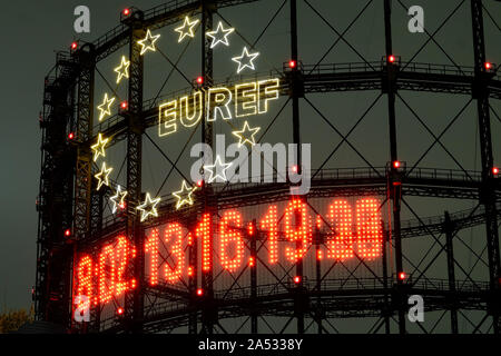 Berlin, Berlin, Germany. 17th Oct, 2019. A 40 metre carbon clock installation by installation by Fridays for Future can be seen during nighttime at the historic Gasometer in SchÃ¶neberg, Berlin. The clock runs backwards and symbolizes the remaining carbon budget for a specific temperature target based on the decision of the Paris World Climate Summit in 2015. Editor Note: The numbers are blurred due to a long exposure of the camera. Credit: Jan Scheunert/ZUMA Wire/Alamy Live News Stock Photo