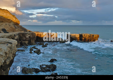 Aveiros beach scene during afternoon. Unique rocks and cliffs formations Stock Photo