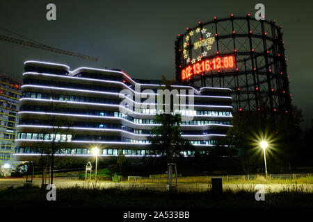 October 17, 2019, Berlin, Berlin, Germany: A 40 metre carbon clock installation by installation by Fridays for Future can be seen during nighttime at the historic Gasometer in SchÃ¶neberg, Berlin. The clock runs backwards and symbolizes the remaining carbon budget for a specific temperature target based on the decision of the Paris World Climate Summit in 2015. Editor Note: The numbers are blurred due to a long exposure of the camera. (Credit Image: © Jan Scheunert/ZUMA Wire) Stock Photo