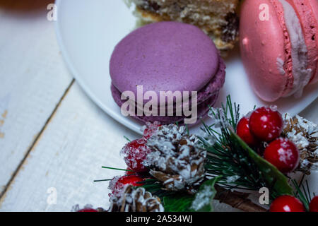 Christmas wreath and multi-colored macaroons. Christmas holidays. copyspace Stock Photo
