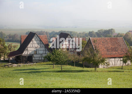 Old farm houses and barns in rural landscape Stock Photo