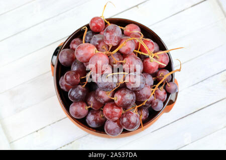 Ripe red grapes isolated on white background. View from above