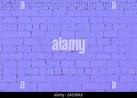 violet plaster rough brick wall texture under direct sunlight Stock Photo