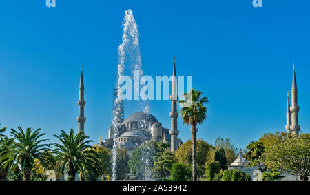 ISTANBUL TURKEY THE SULTAN AHMED BLUE MOSQUE IN EARLY MORNING LATE SUMMER WITH SPRAY FROM A FOUNTAIN Stock Photo