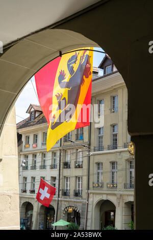 Flags and coat of arms hanging on the arcades in Gerechtigkeitsgasse, Bern, Canton Bern, Switzerland Stock Photo