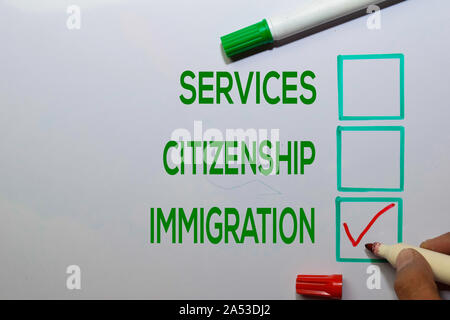 Services. Citizenship, Immigration with red checklist write on white board background. Stock Photo