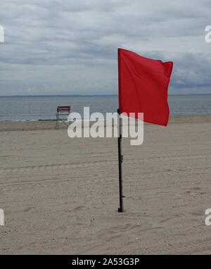 New York, USA. 10th Sep, 2019. A red flag is blowing on the beach of Coney Island in New York's Brooklyn district. The red flag on beaches indicates that bathing is prohibited. The beach along the Atlantic coast is very well visited in summer. Credit: Alexandra Schuler/dpa/Alamy Live News Stock Photo