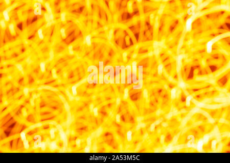 Futuristic blurred lights holiday monochrome background in yellow. Horizontal, soft focus Stock Photo