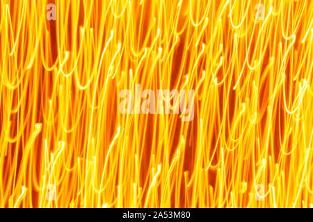 Futuristic blurred lights holiday monochrome background in yellow. Horizontal, soft focus Stock Photo