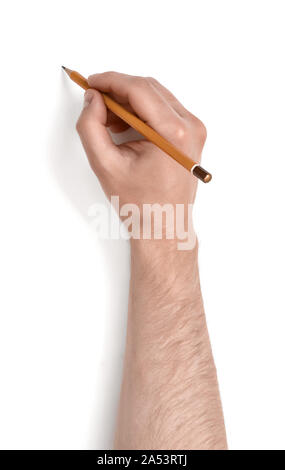 Close-up hand of man writing something on white canvas. Stock Photo