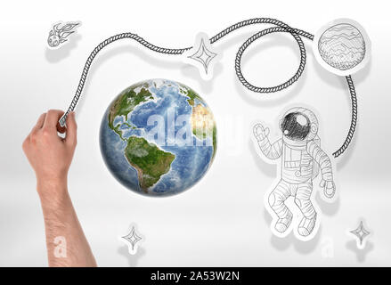Globe and drawn astronaut, rockets, comets, stars. Stock Photo